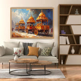 A framed painting of ornate golden chariots in a street scene, displayed on a light gray sofa in a modern living room with a wooden coffee table, bookshelf, and decorative pillows.