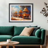 A framed art print depicting three ornate golden chariots under a dramatic blue sky, displayed on a light gray wall above a green sofa with decorative pillows.