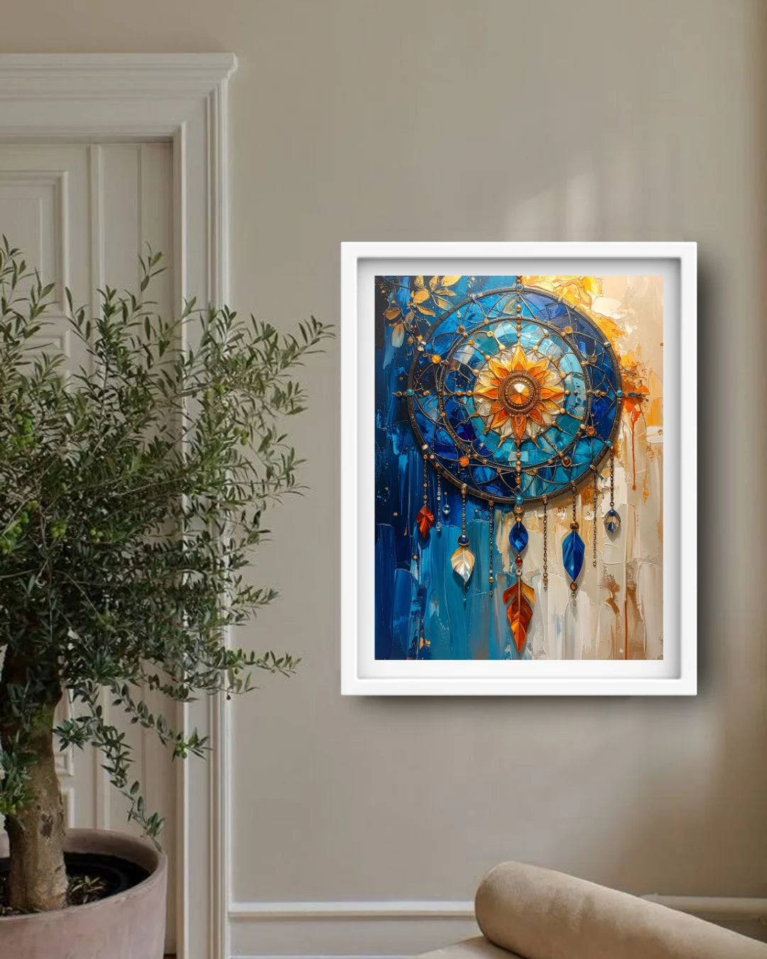 Framed bohemian dreamcatcher wall art hanging on a beige wall in a styled room next to a potted plant.