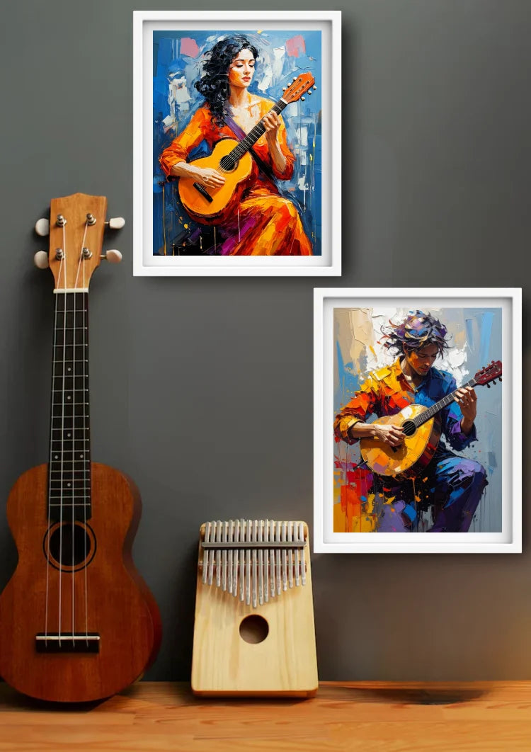 Two framed colorful paintings of women playing guitars are displayed on a dark gray wall above a wooden surface, alongside a brown ukulele and a kalimba.
