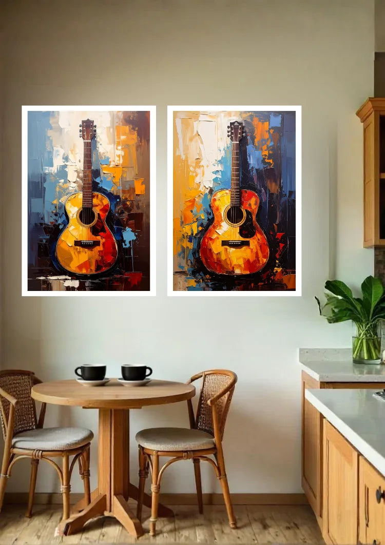 Two framed vertical paintings of colorful abstract acoustic guitars hanging side-by-side on a beige wall in a dining room setting.