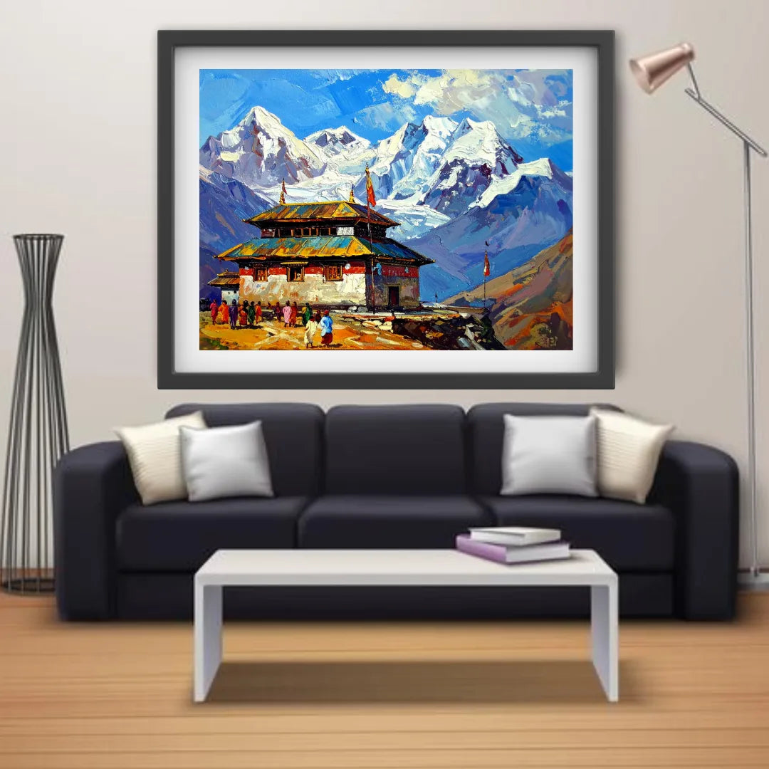 Framed mountain landscape painting above a black sofa in a living room.