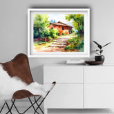 Framed landscape painting above a white cabinet with decorative items.