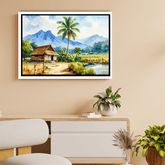 Framed landscape painting of a hut and palm tree on a wall above a desk.