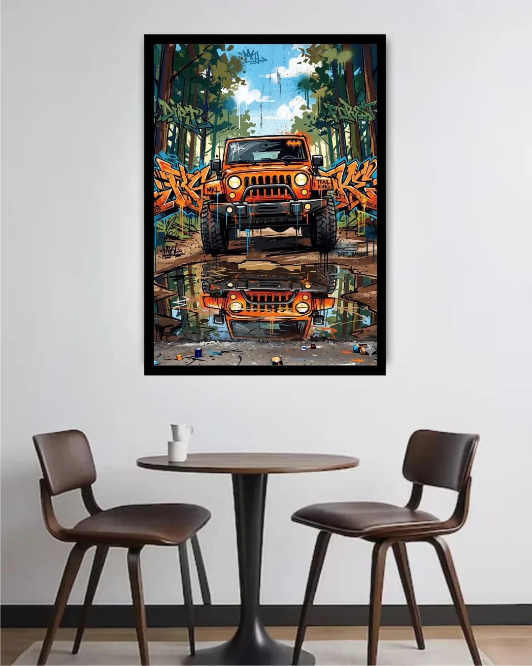 Framed artwork of an orange truck in a forest setting above a table with chairs.