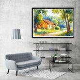 Framed landscape painting above a modern living room setup with a gray sofa and coffee table.