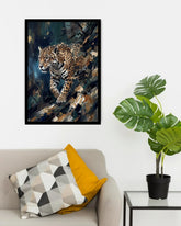 A framed art print of a leopard in a dark, textured background, displayed on a white wall above a beige sofa with decorative pillows and next to a potted monstera plant.