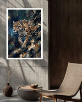 A framed wall art print featuring a detailed painting of a leopard in motion, styled in a modern interior setting with a gray stone wall, dark wood paneling, a woven chair, and a small decorative vase.