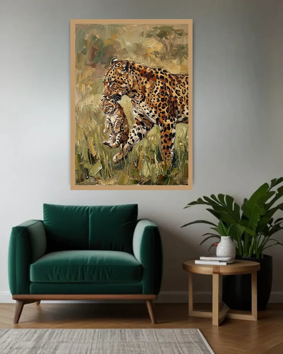 Framed artwork of two leopards on a wall above a green armchair in a room with a plant and side table.