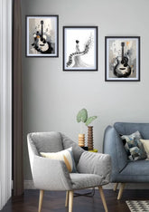 Elegant guitar and piano canvas wall art displayed in a stylish modern living room with armchair and sofa.