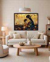 A framed art print depicting a mother and child in a golden field of flowers, displayed on a beige wall above a modern white sofa in a styled living room.