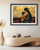 A framed art print depicting a mother and child in a golden field, styled on a wall above a wooden console table with neutral decor.