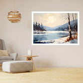 A framed landscape art print depicting a snowy lakeside scene with trees and mountains under a pale moon, displayed on a beige wall in a modern living room setting.