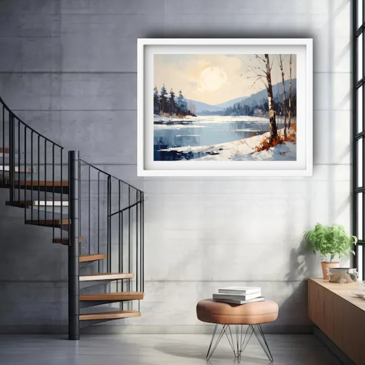 A framed landscape painting of a snowy lake and forest under a pale sky, displayed on a light gray wall in a modern interior with a spiral staircase, stool, and small plant.