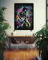 Framed artwork of a guitarist with colorful abstract elements in a room with a desk and plants.