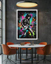 Framed poster of a musician playing guitar in a colorful setting above a dining table with orange chairs.