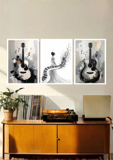 Contemporary musical canvas wall art with guitar and piano displayed above a wooden console table in a modern home.