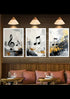 Three framed abstract musical note wall art prints hang above a wooden bench with pink cushions in a styled interior setting.