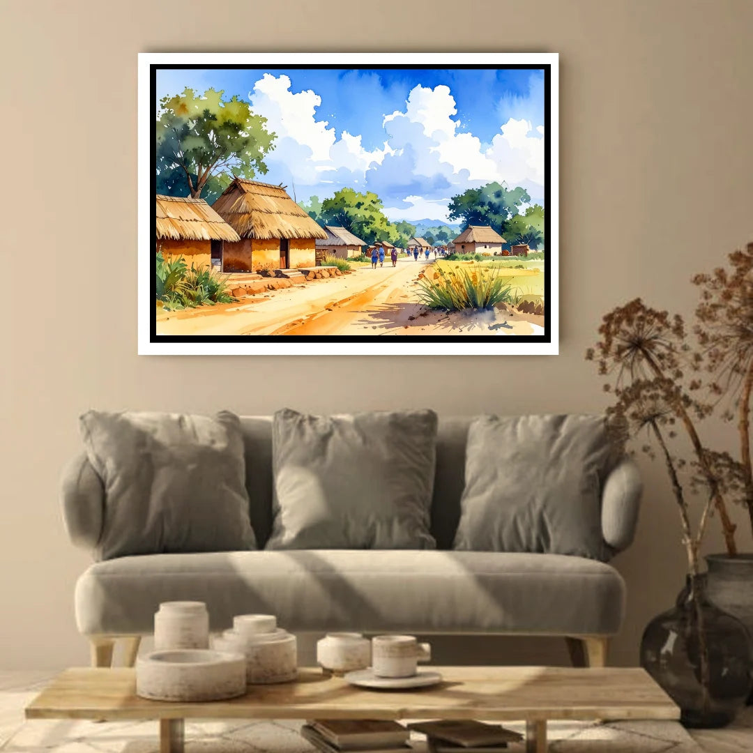 Framed painting of a village scene above a gray sofa in a living room.