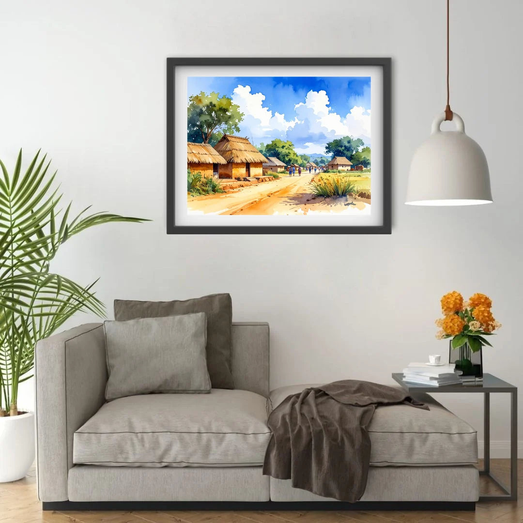 Framed painting of a village scene above a gray sofa in a living room.
