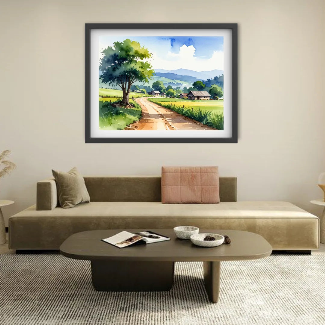 Living room with a sofa, coffee table, and framed landscape painting on the wall.
