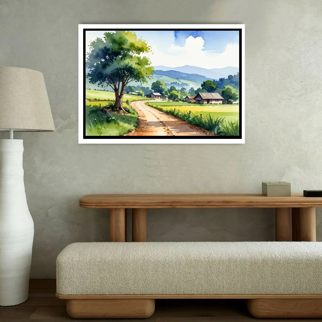 Framed landscape painting of a rural scene on a wall above a wooden console table.