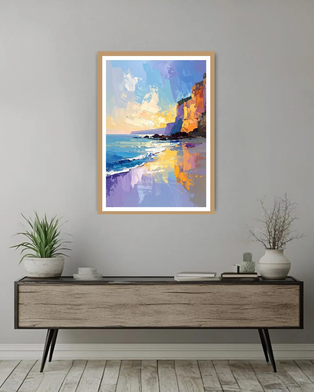 sunset ocean cliff painting displayed in modern home setup