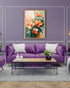 Orange floral wall art canvas displayed above a purple sofa in a modern living room
