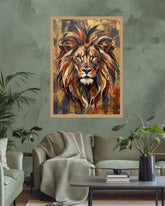 A framed wall art print featuring a stylized lion portrait in warm brown, gold, and orange tones, displayed above a sofa in a living room setting with plants and a table.