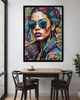 Colorful street art-style painting of a woman with sunglasses on a wall above a dining table.