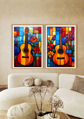 Two colorful abstract paintings of guitars on a wall above a white sofa.