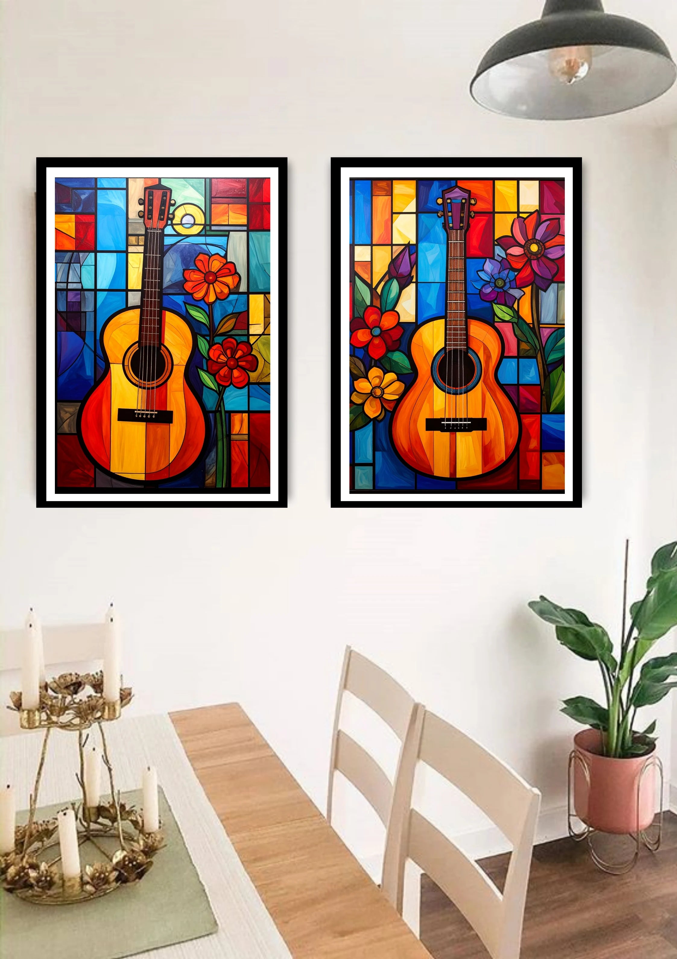 Two colorful framed artworks of guitars and flowers on a wall above a dining table.