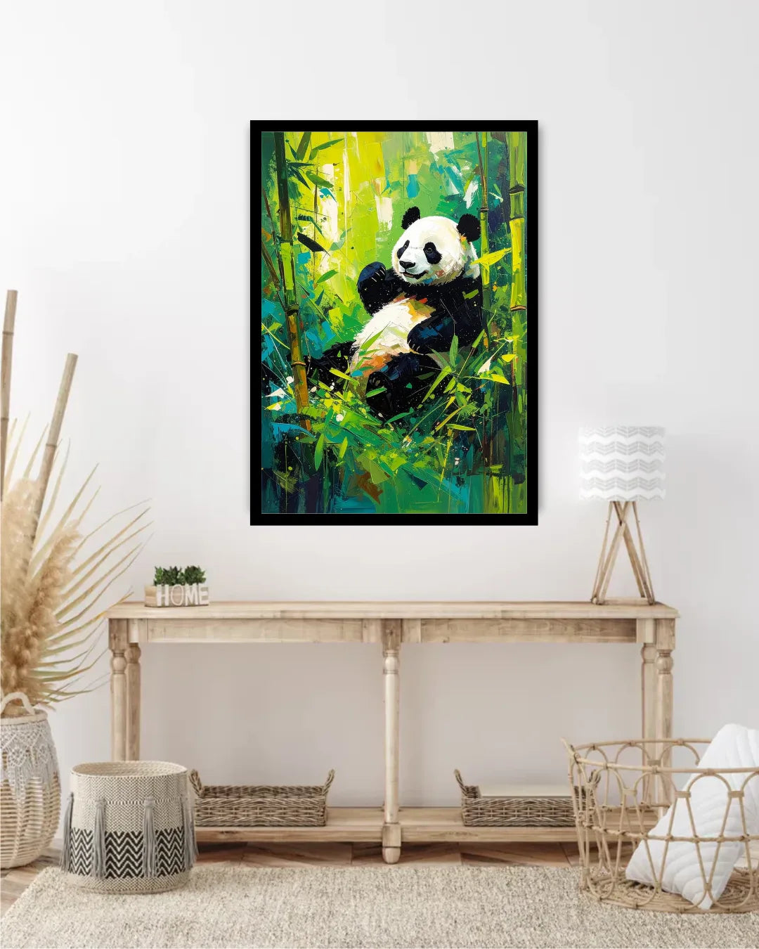 Framed painting of a panda in a bamboo forest hanging on a wall above a wooden console table.