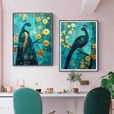 Two framed paintings of peacocks with yellow flowers on a wall above a dining table.