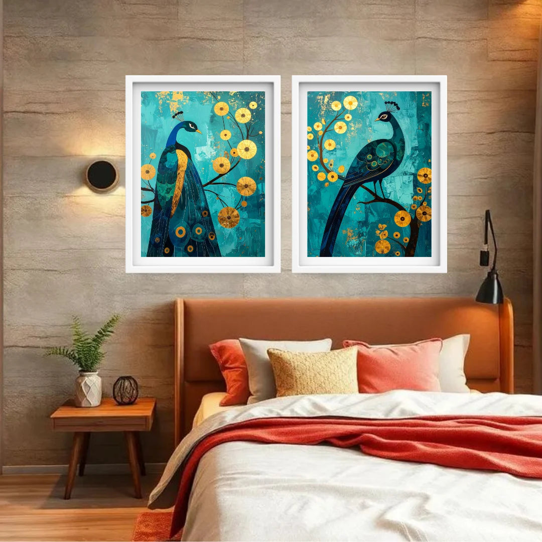 Two framed peacock artworks on a wall above a bed with colorful bedding.