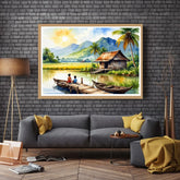 Framed painting of a tropical scene with a hut and boat on a wall above a gray sofa.