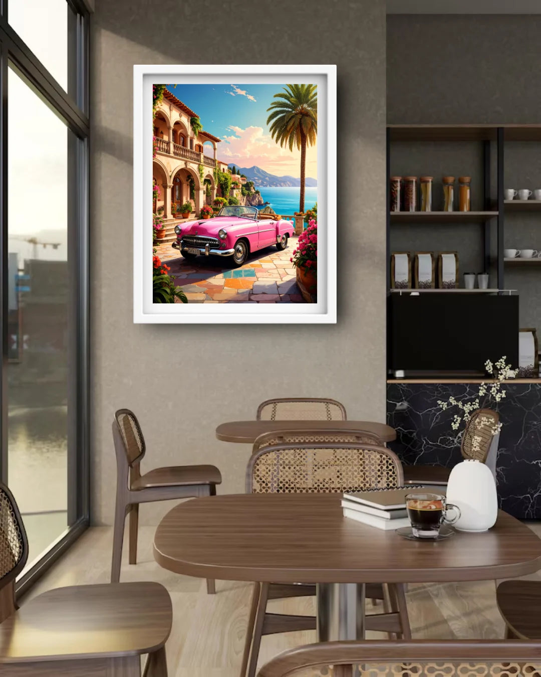 Framed artwork of a pink car by a coastal scene in a modern cafe.