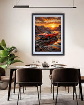 Framed artwork of a red car at sunset over water in a dining room.