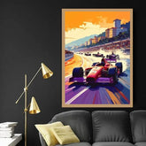A framed vertical art print depicting a vibrant Formula 1 race at Monaco, featuring a red and purple race car on a colorful track under an orange sky, displayed on a dark wall above a modern gray sofa with gold accents.