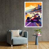 A framed art print of a vibrant Formula 1 race in Monaco, featuring red race cars on a purple track under an orange sky, displayed on a textured gray wall above a light blue armchair and a small side table.