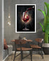 Dining area with a framed picture of red wine being poured on the wall.