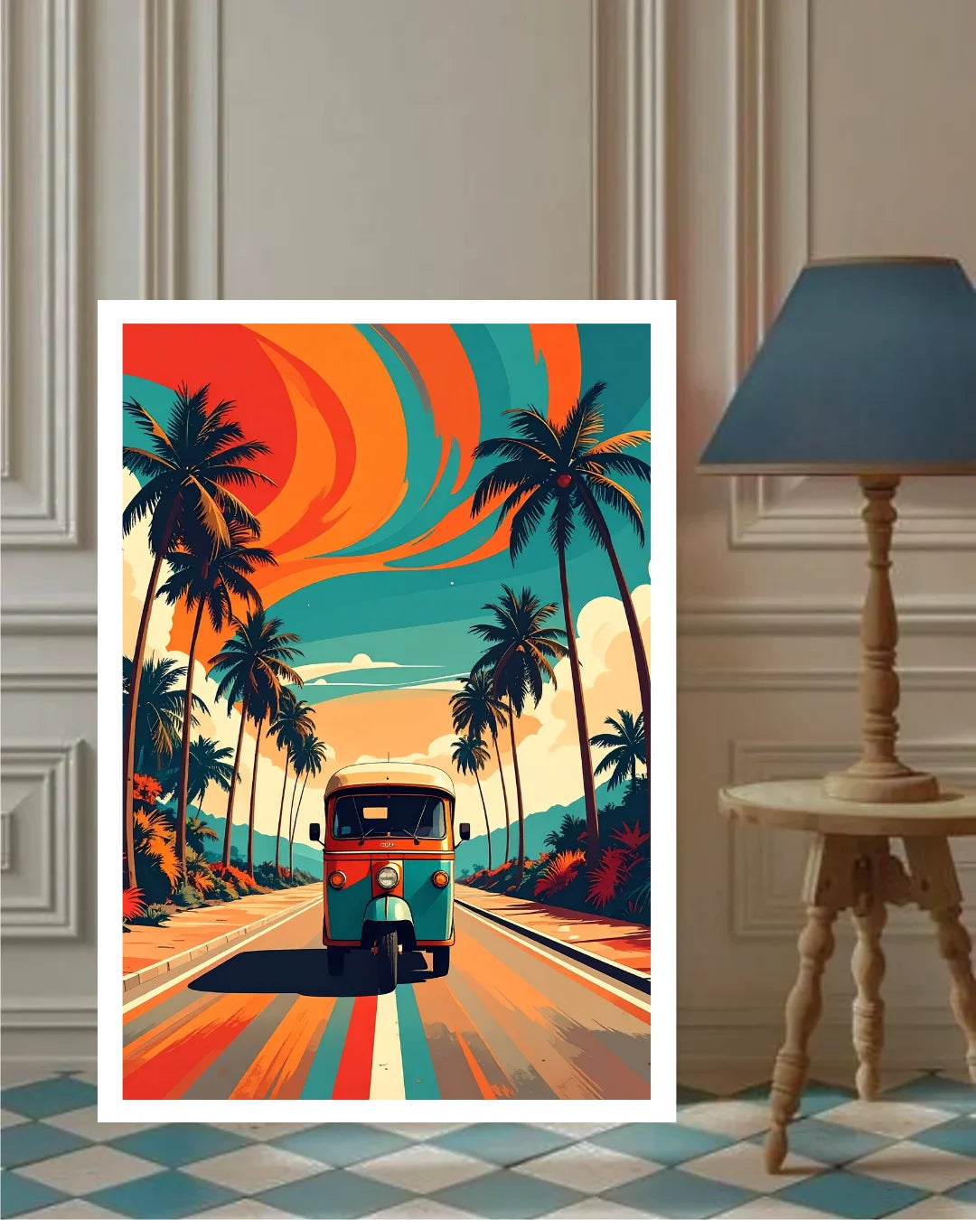 A vertical art print featuring a retro tropical road scene with palm trees, a teal tuk-tuk, and bold orange and teal swirls in the sky, displayed against a beige paneled wall next to a wooden floor lamp.