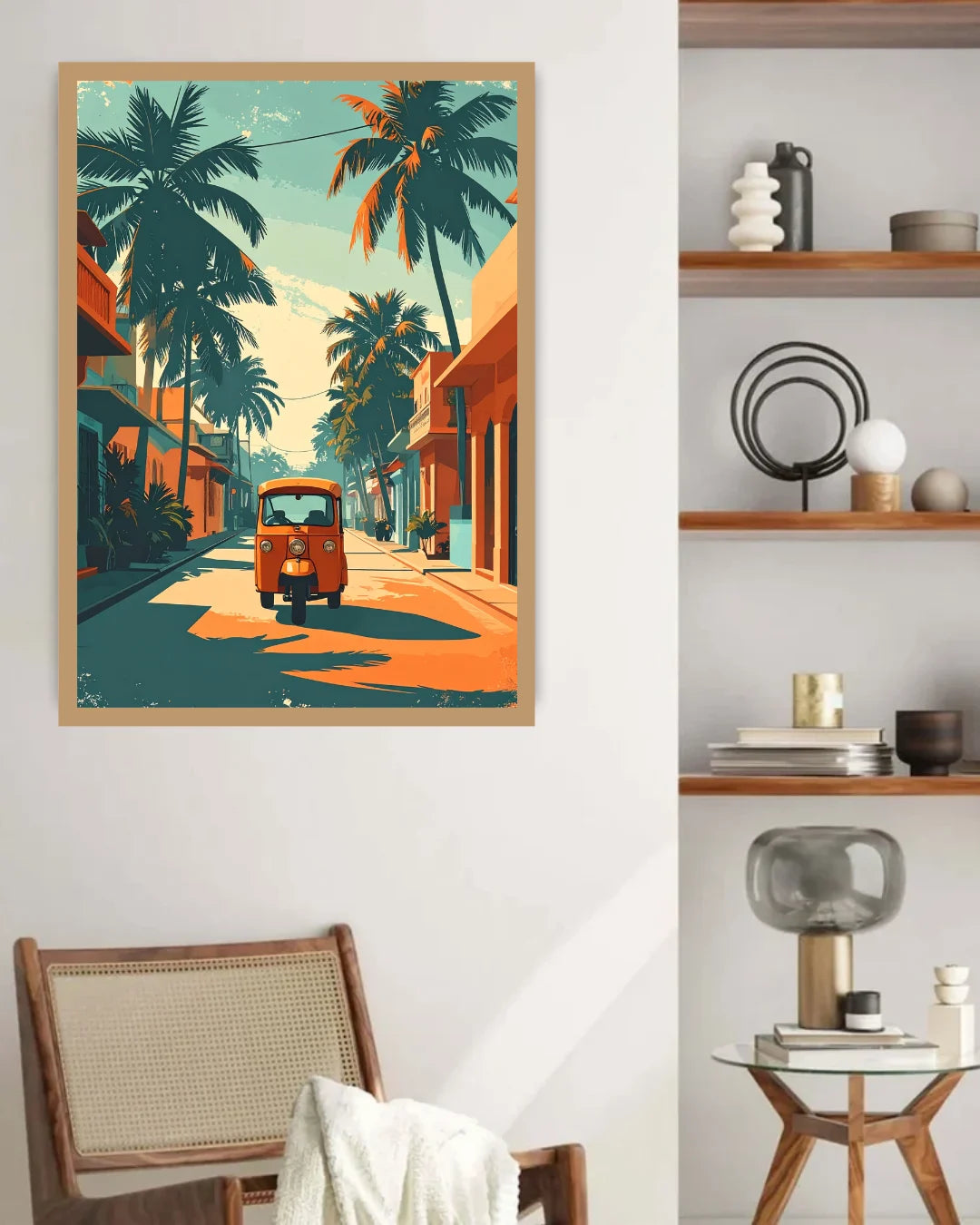 A framed art print of a serene mountain lake landscape with a large golden sun and tree reflections, displayed on a light gray wall above a neatly made bed in a modern bedroom setting.
