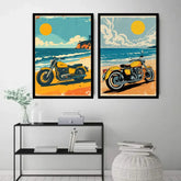 Two framed vertical art prints depicting retro yellow motorcycles on a beach, displayed side-by-side on a light gray wall above a black metal shelf with books and decor.