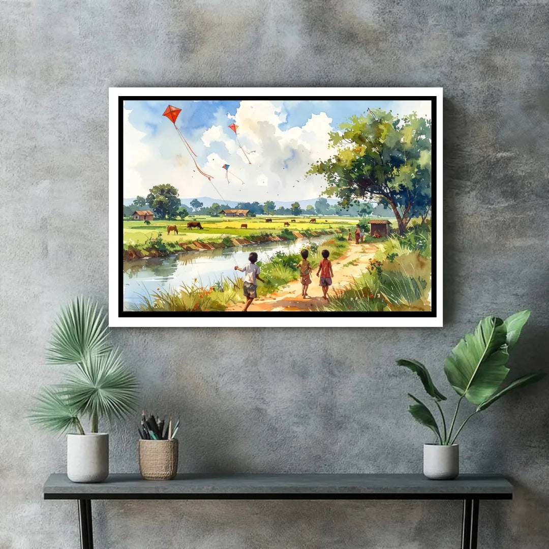 Framed painting of children by a river with kites on a gray wall above a black console table with plants.