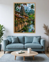 A large framed wall art print depicting a lush tropical temple scene with a canal, bridge, and palm trees, displayed above a light blue sofa in a modern living room setting.