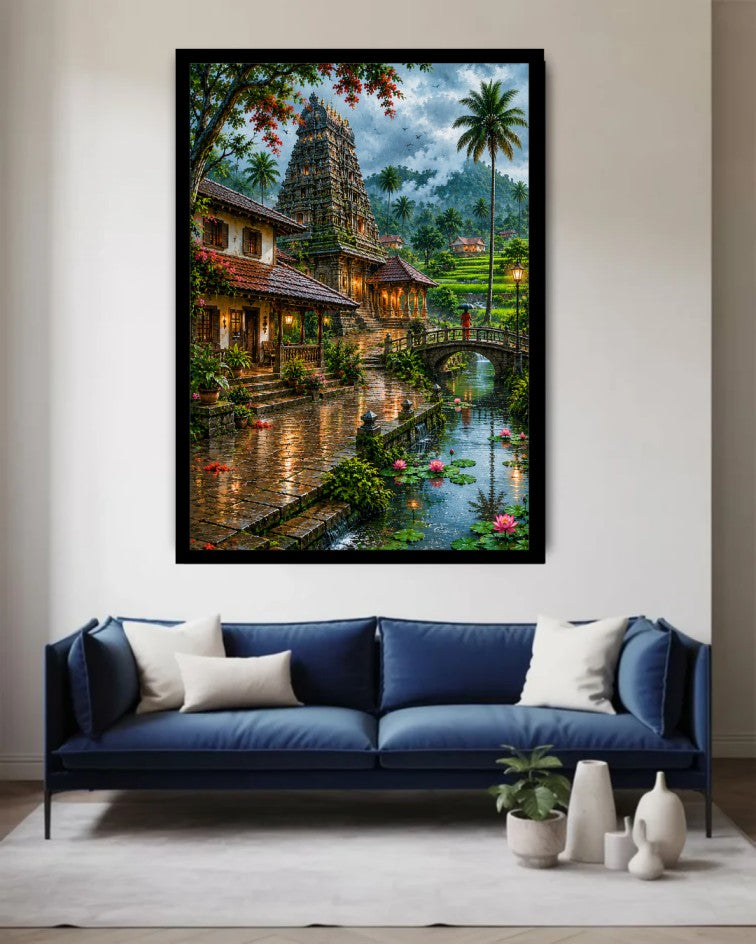 A large framed wall art print depicting a lush tropical temple scene with a river, bridge, and palm trees, displayed above a blue sofa in a modern living room setting.