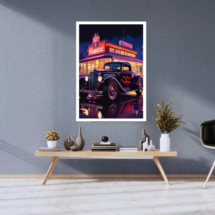 A framed vertical art print featuring a retro neon-lit hot rod car in front of a diner, displayed on a gray wall above a styled wooden console table in a modern room.