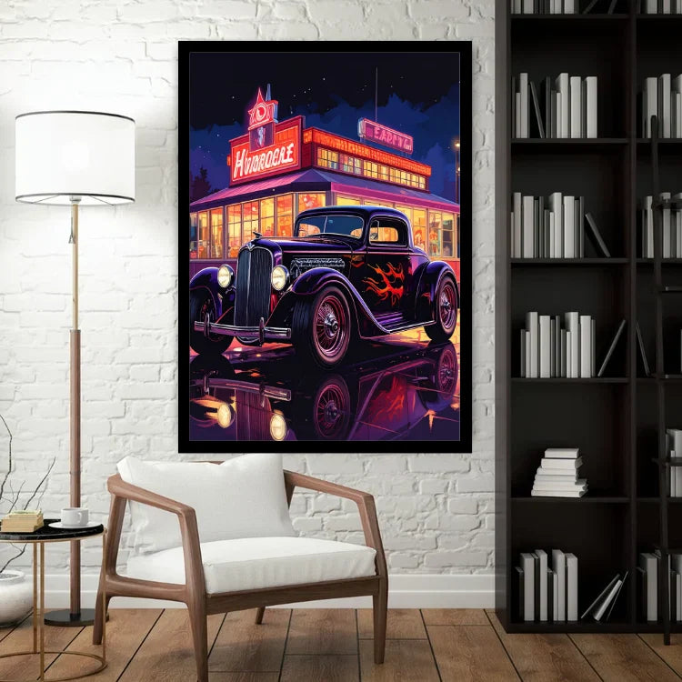 A framed wall art print showing a neon-lit vintage car in front of a diner, displayed in a styled room with a white brick wall, floor lamp, chair, and bookshelf.