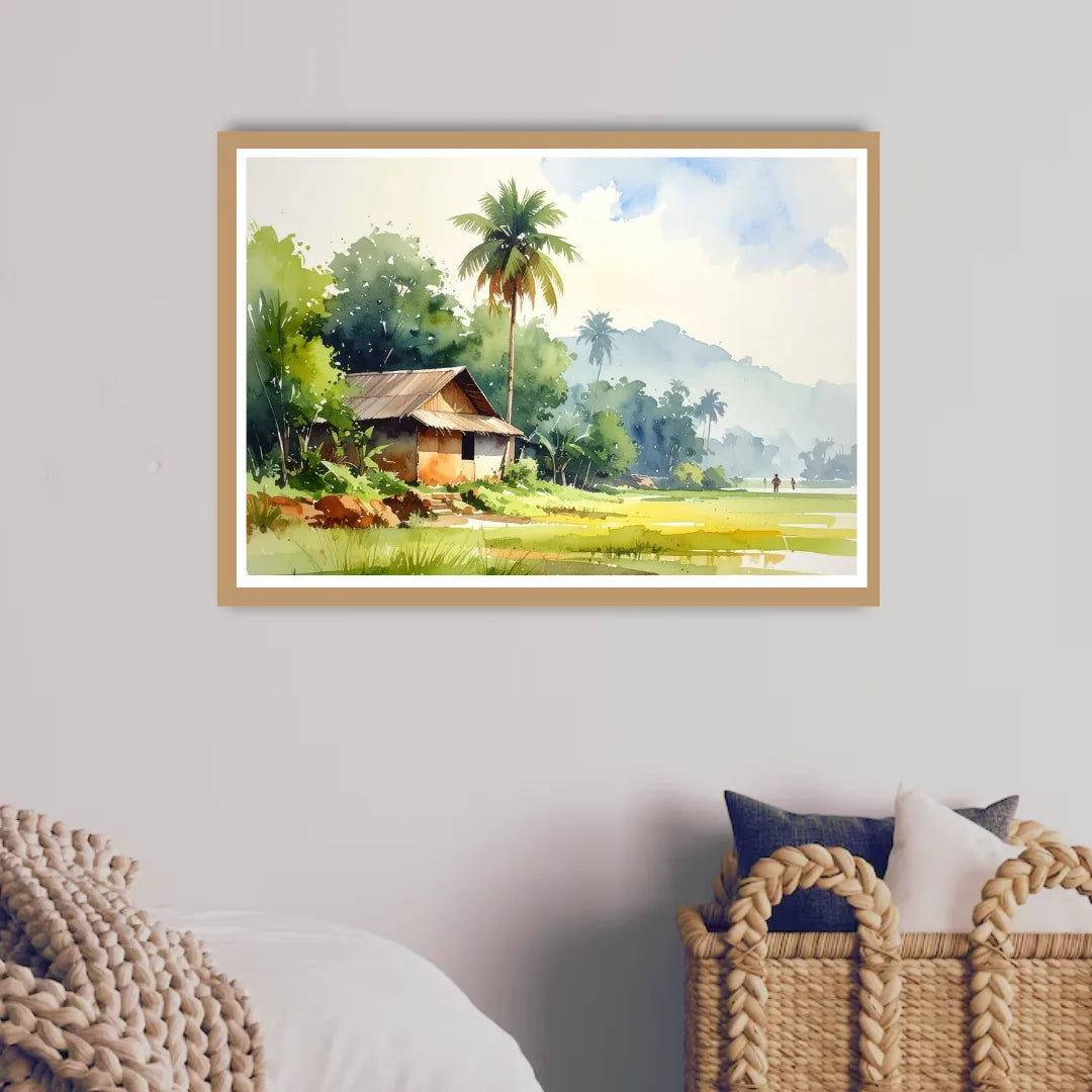 Framed landscape painting of a rustic cabin in nature on a wall above a chair.